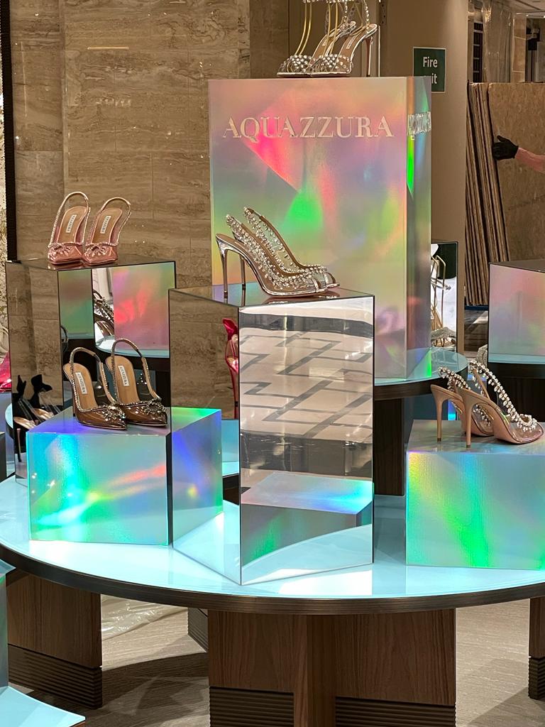 Iridescent display pedestals in high-end retail setting.
