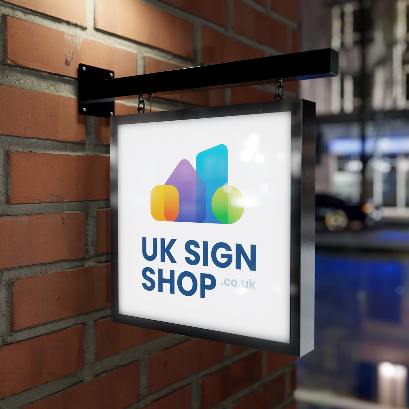 Illuminated hanging sign produced by UK Sign Shop, mounted on a brick exterior wall at dusk.