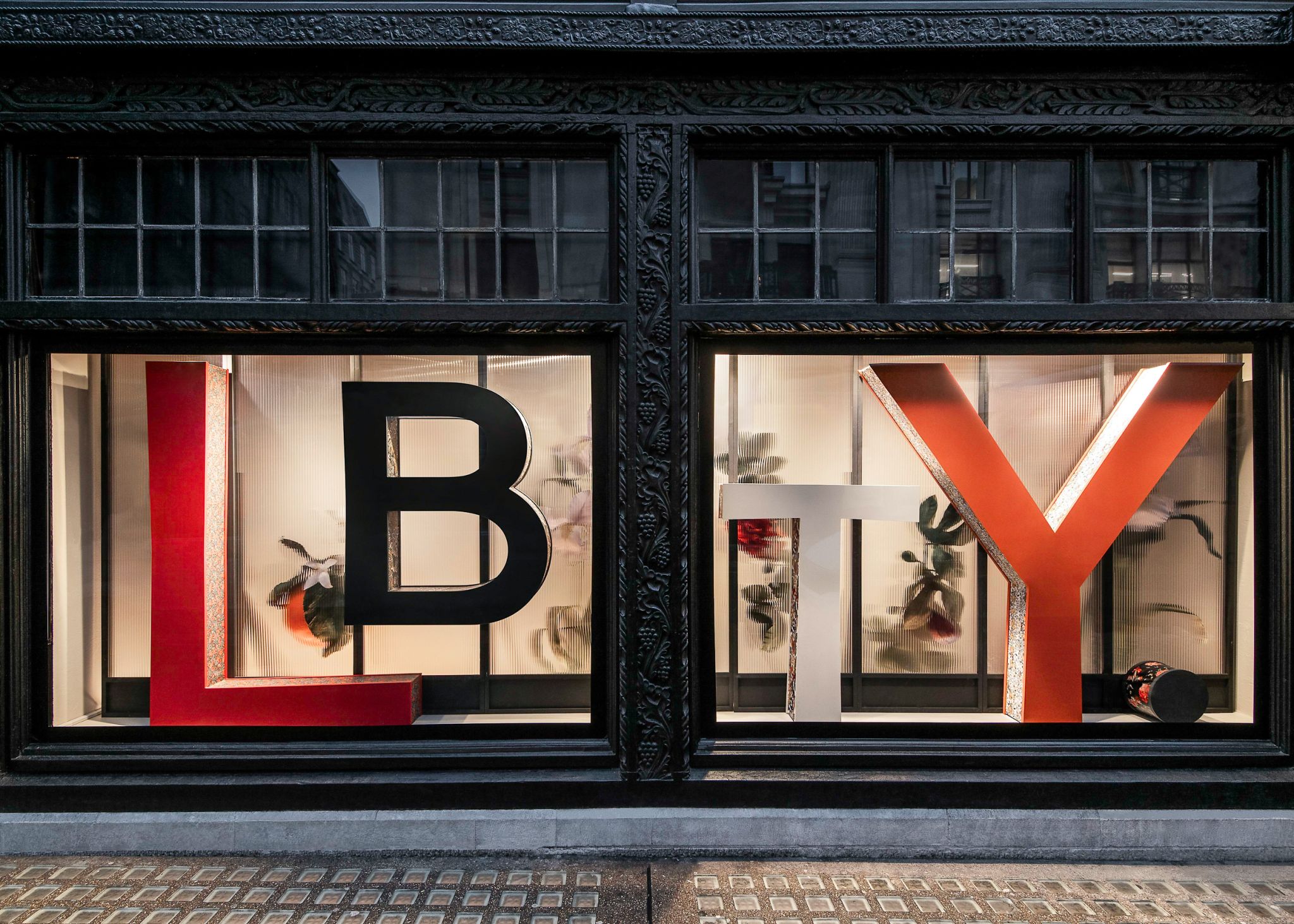 Installed branded 3D letters on window display showing high-quality fabrication and professional installation.